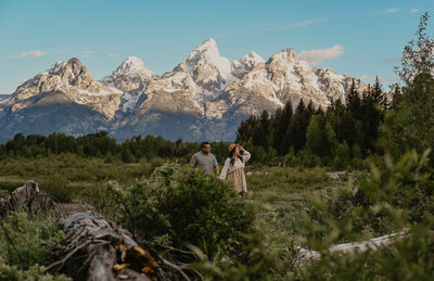 A cool, sunny sunrise couples photo session at Schwabacher Landing, Wyoming.
