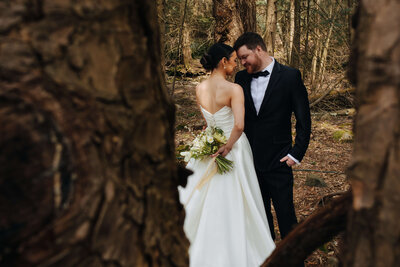 Couple posing in the woods after their Hudson Vallery wedding ceremony