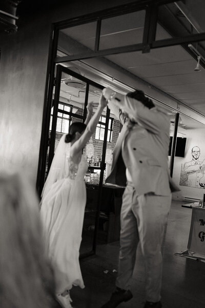 bride and groom jumping and dancing