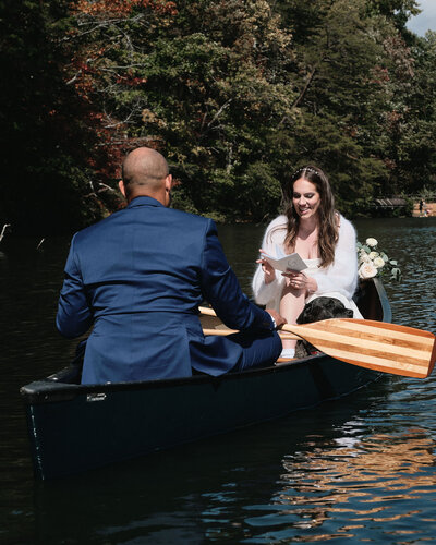 Couple saying vows on a canoe