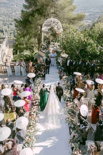 Bride in a voluminous couture wedding gown inside a historic château, photographed by a luxury destination wedding photographer in Italy