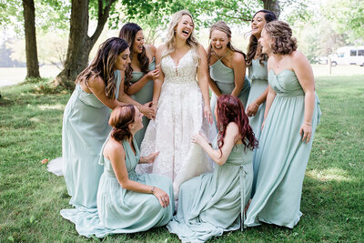 bride laughing with her girls