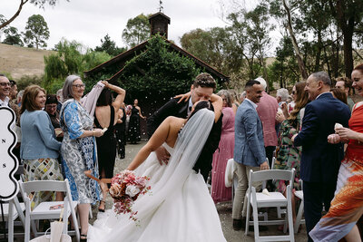 bride and groom kissing at the end of their ceremony