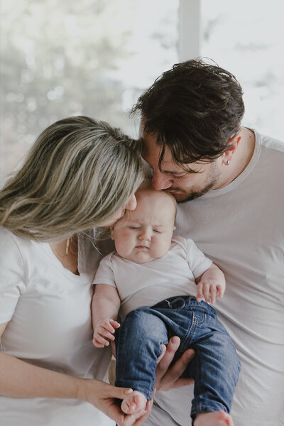 photo of couple with their baby