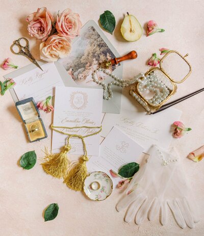 Eclectic and elegant flatlay with invitations and accessories