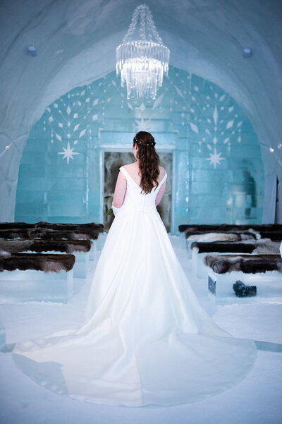A bride stands in the ceremony hall of the Icehotel in Jukkasjärvi, Sweden