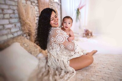 Tacoma Mom Holds 4-Month-Old Baby in Boho Lifestyle Studio during session with Lana Stewart Full-service Photographer