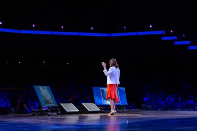Brittany Hodak waves to the crowd at the Grand Ole Opry during her keynote.