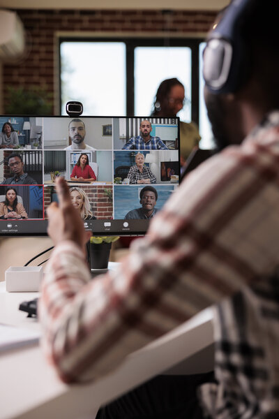 A team on an all-hands video call on a computer.