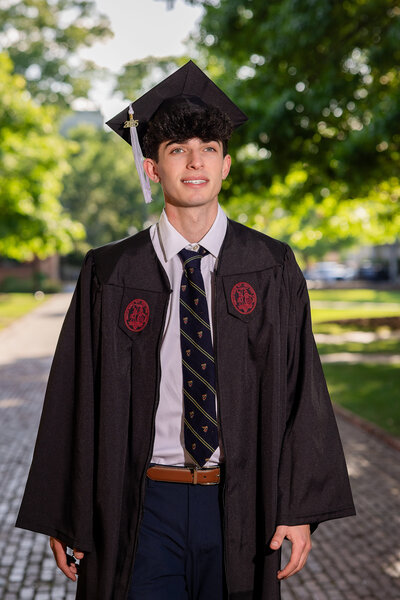 A University of South Carolina student taking his senior portraits on campus