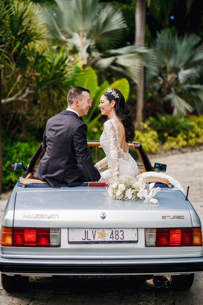 A bride and groom in front of the 100-year-old ficus tree in Dorado Beach Ritz-Carlton Reserve, Puerto Rico