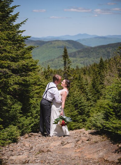 vermont elopement couple hugging on a mountain trail