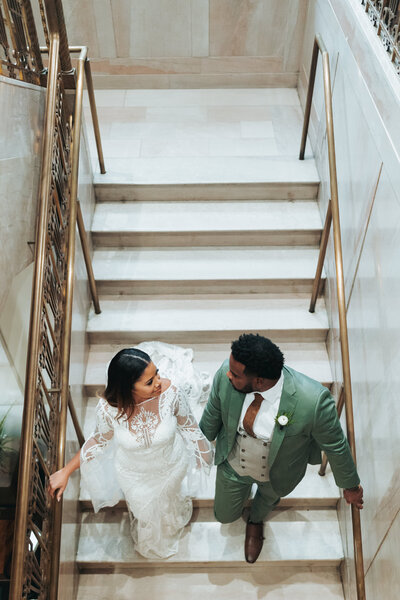 couple walking down the stair in a downtown hotel