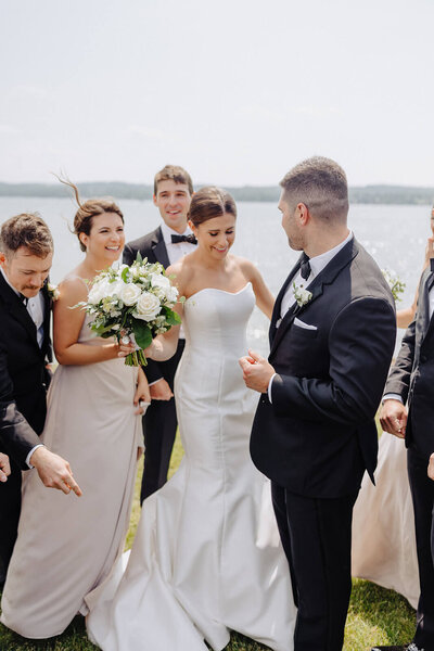 Groom looking at bride after wedding ceremony at Finger Lakes New York