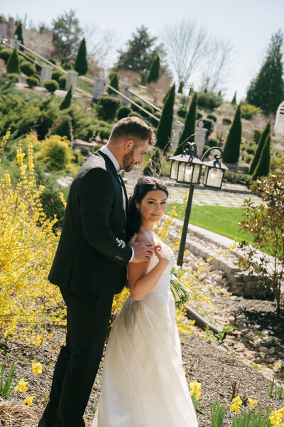 bride and groom holding hands and walking during golden hour 