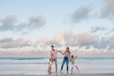 Family photo shoot at sunrise on Indian Shores Beach