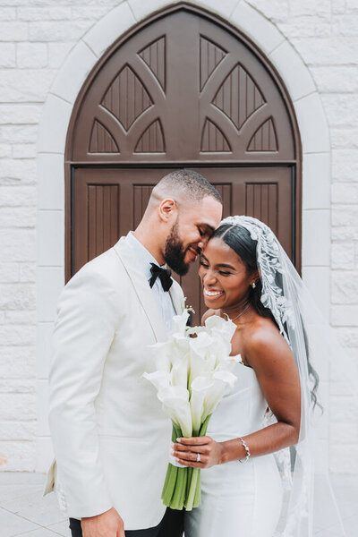 groom resting his head on bride