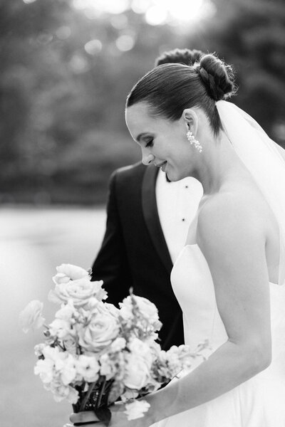 elegant black and white photo of Bride and groom during sunset hour