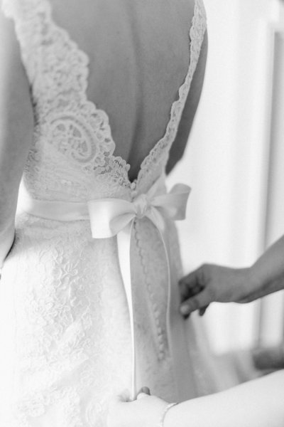 a close up of a bride's bow on back of dress