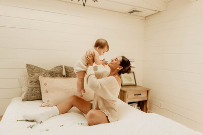 A mother holding her baby during a mommy and me photo session in New Jersey