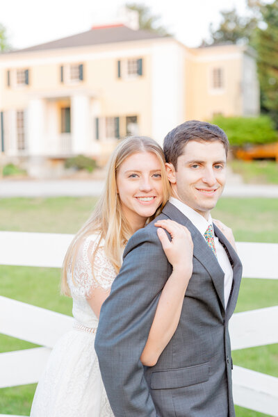 A bride and groom share a kiss at their wedding at Airlie for Northern Virginia Wedding Photographer