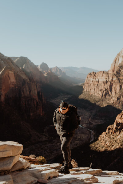 Photographer looking at the ground overlooking Zion