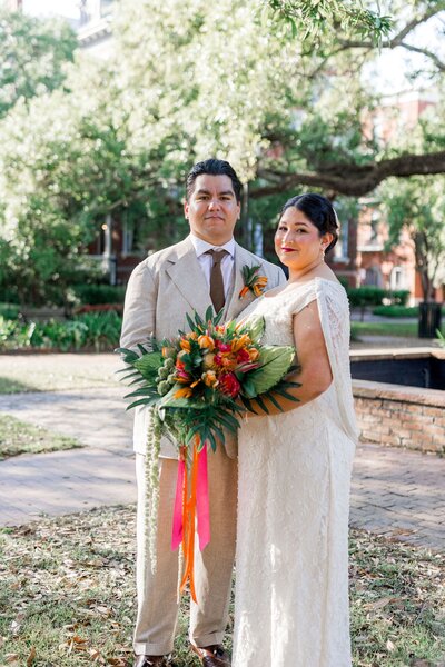 A sweet portrait of Gabriela and Adrian after their elopement ceremony at Columbia Square in Savannah, captured as part of our Savannah Elopement Package.
