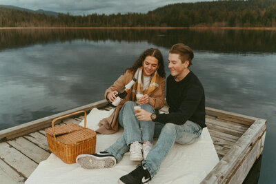 photo of a girl and boy on a picnic on a pier