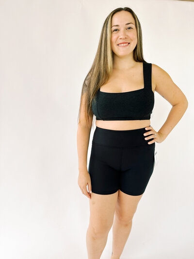 woman wearing black squareneck beyond yoga bra