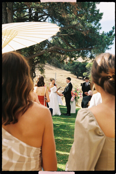 bride poses with wine glass on wedding day in adelaide