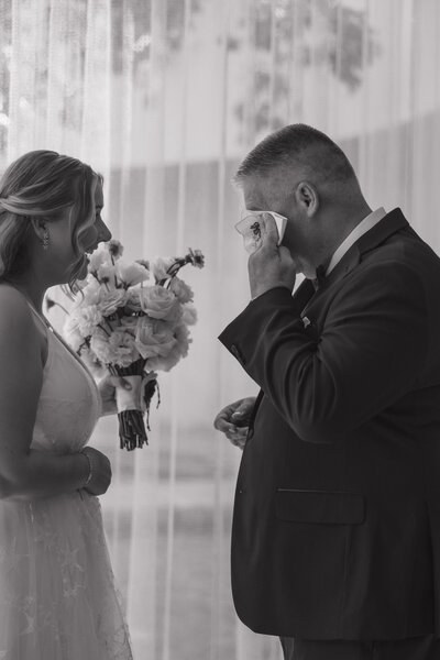 Dad and daughter share a special moment at her wedding
