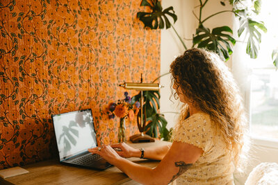 Dream Like portrait of woman sitting in flowers 
