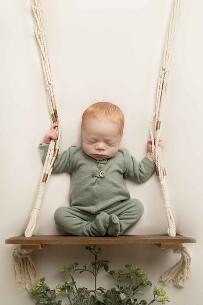 Red Head Newborn on Swing with Heather Bush