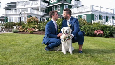 Grooms posing with their dog
