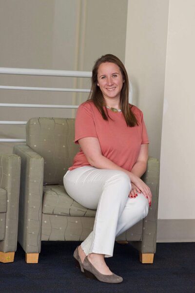 Emily Calvo Sitting in her office chair as she smiles at the camera. She is a couples therapist in Florida. Contact a marriage counselor for support. An online therapist can provide services from the comfort of home.