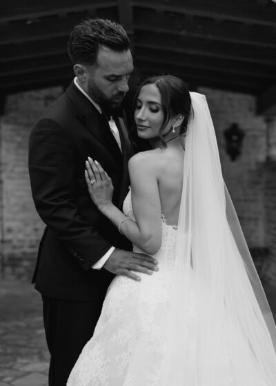 Bride and groom post together for a photo the night before their wedding at El Chorro in Paradise Valley, AZ during their rehearsal dinner at the venue. 