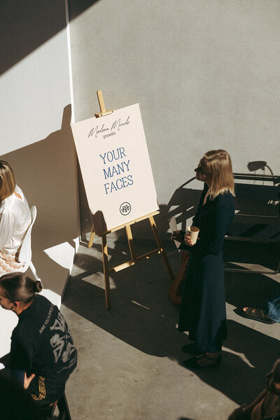 Arrival moments at an outdoor event with welcome sign, captured authentically by event photography Sunshine Coast."