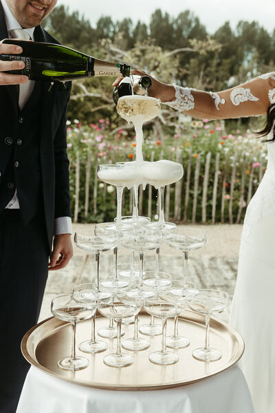 Get framed photography wedding photograpy europe Cheers bride and groom champagne tower