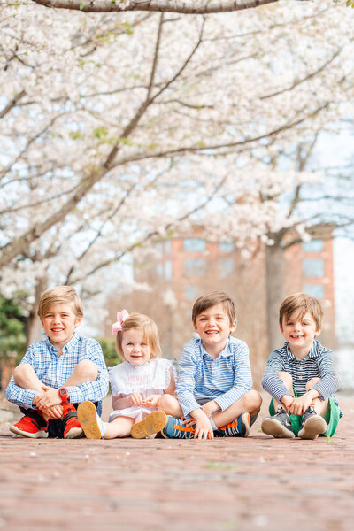 Downtown session with young family and blooming cherry trees by photographer in Chattanooga