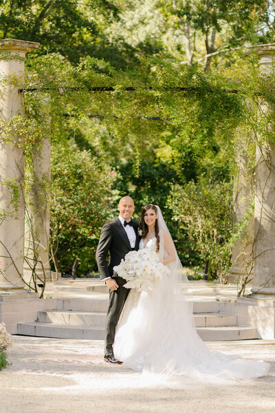 A couple standing in front of the Swan House in Atlanta, GA