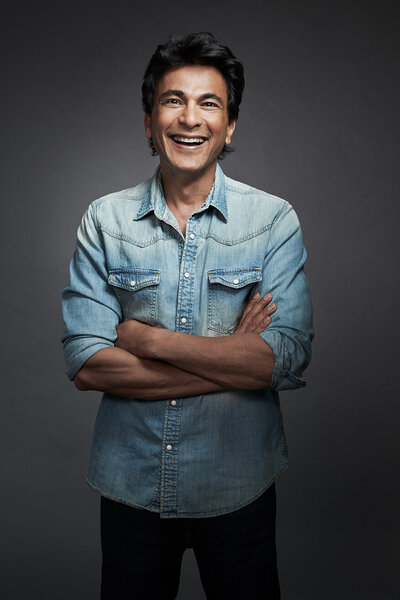 Casual portrait of Vikas in a denim shirt, exuding confidence, shot by Ylva Erevall.