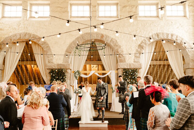 aswanley wedding ceremony set up with festoon lights scotland wedding venue
