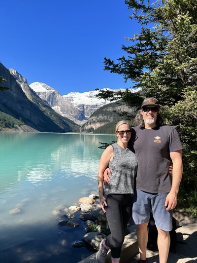 Family by the turquoise lake in Banff, Canada — outdoor parenting and expat family adventures on Leaving Main Street blog