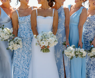 bride with champagne wearing pearl bridal gloves