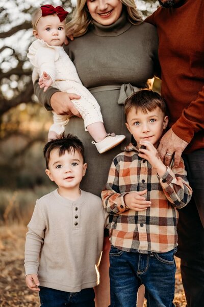 Motherhood session with mom , newborn, and older child