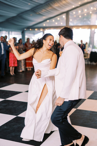 Bride and groom dancing on checkboard dance floor at Glen Foerd Estate in Philadelphia, PA