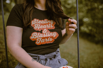 Shirt that says "stealing hearts and blasting farts"