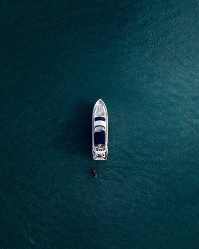 A yacht in the middle of a deep blue ocean