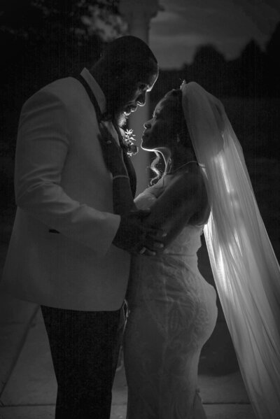 Intimate black and white wedding portrait of bride and groom at Duneland Falls