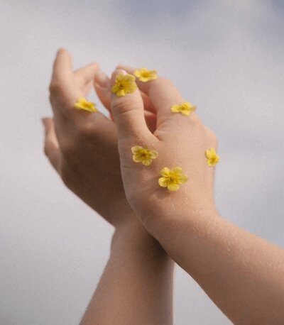 Hands with small flowers on them